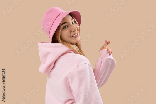 Young woman making heart wi...
