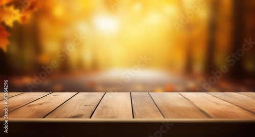 Empty wooden table over blurred autumn background. Ready for product display montage. High quality photo