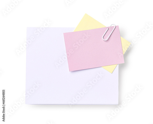 Sticky note with paper clip on white background