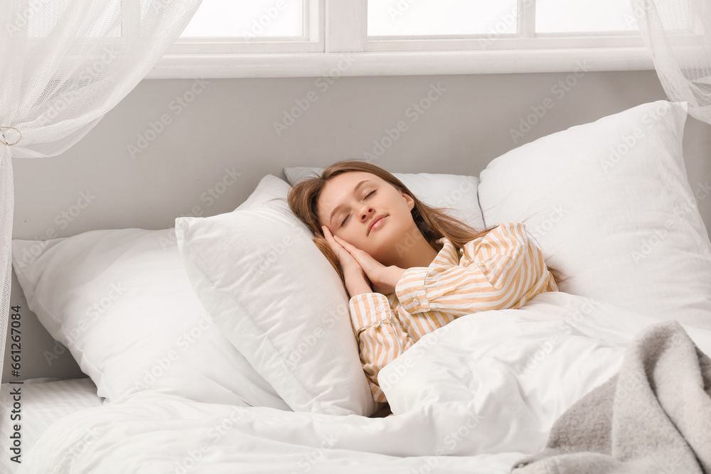 Morning of pretty young woman sleeping in soft bed Morning of pretty young woman sleeping in soft bed