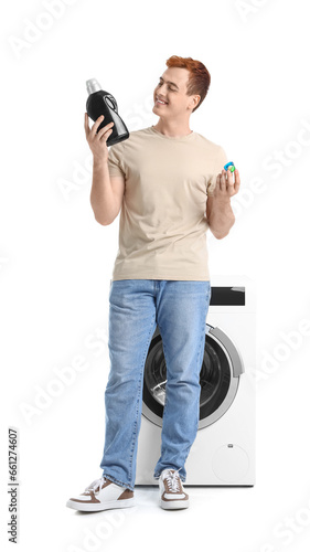 Smiling young man holding l...