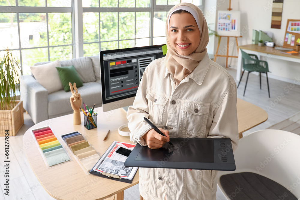 Muslim interior designer with graphic tablet in office