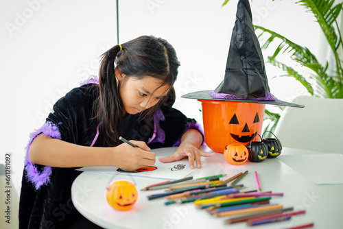 Wallpaper Mural Halloween, holiday and childhood concept. Little kids southeast asian on halloween dressed in a witch costume. Torontodigital.ca