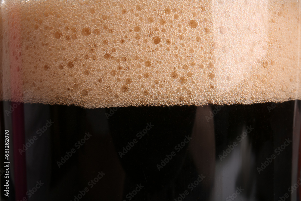Glass of dark beer with foam as background - obrazy, fototapety, plakaty 
