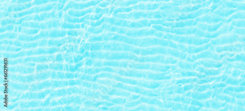 turquoise ocean waves, top view. Blue sea surface with transparent water as background