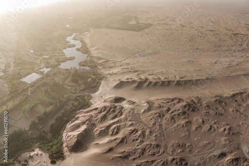 Photo of a vineyard in a desert landscape captured from above, Gansu - China photo