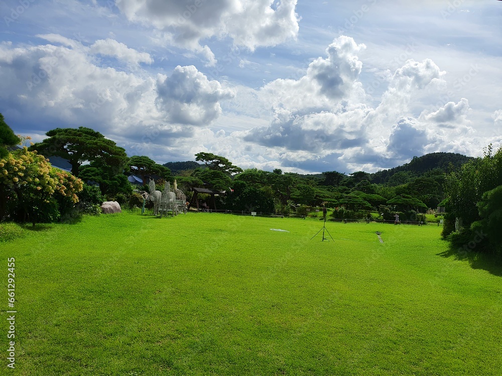 Beautiful scenery with clouds and a large yard