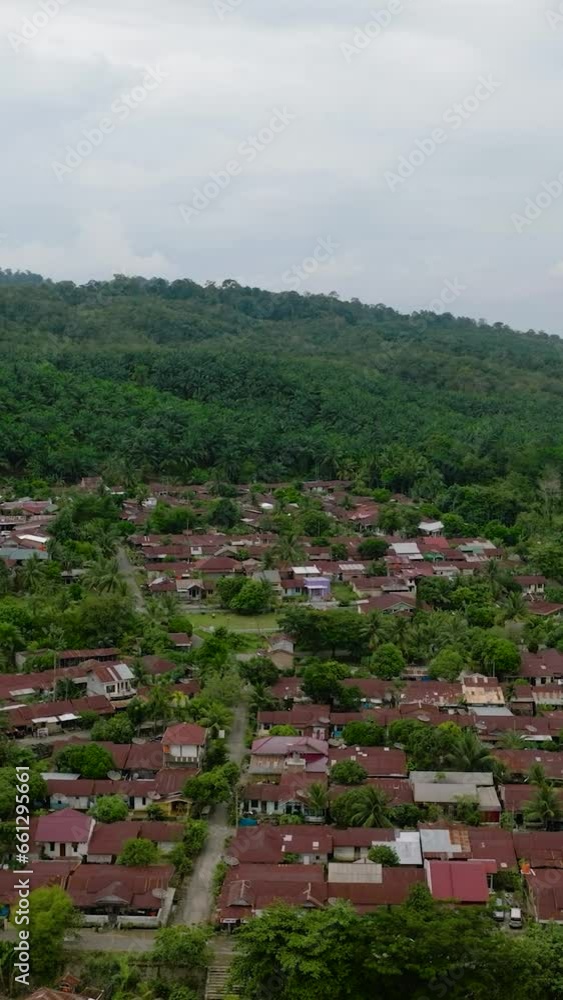 Aerial drone of Bukit Lawang is a popular tourist destination located in rainforest. Sumatra, Indonesia. Aerial drone of Bukit Lawang is a popular tourist destination located in rainforest. Sumatra, Indonesia.
