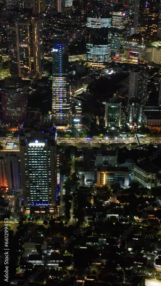 Streets and buildings of Jakarta illuminated at night. Streets and buildings of Jakarta illuminated at night.
