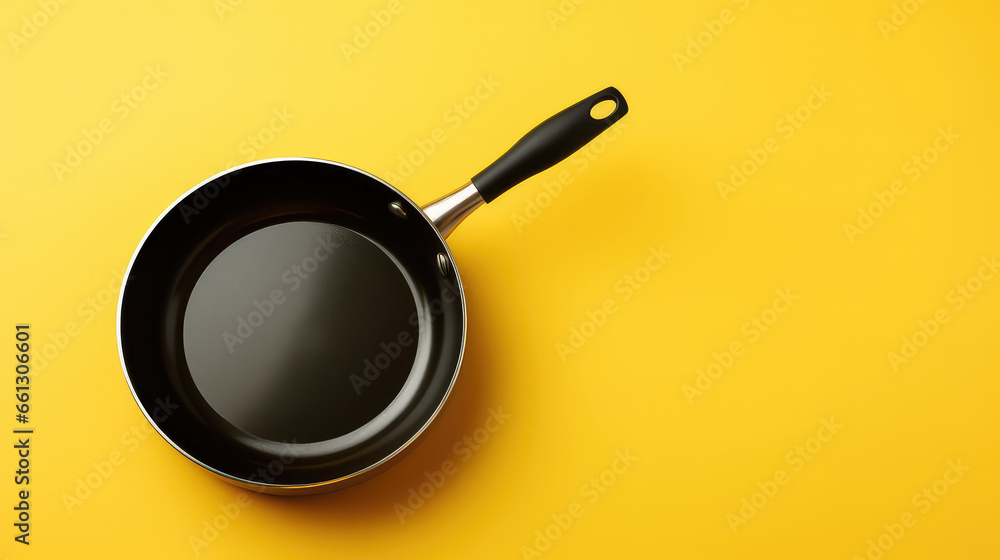 frying pan on yellow background.  - obrazy, fototapety, plakaty 