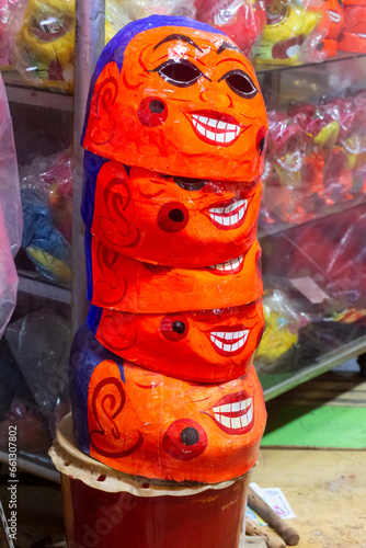 Earth God face mask selling on Luong Nhu Hoc Street, Ho Chi Minh City, Vietnam