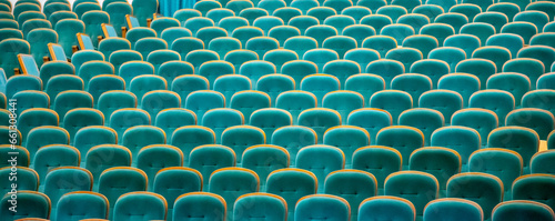 Empty soft chairs in the cinema hall.