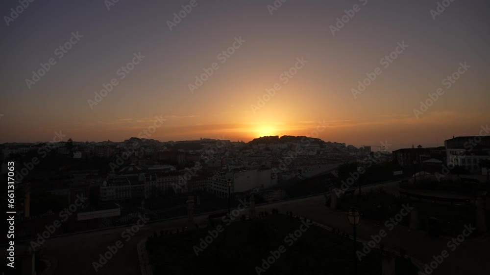 Sunrise over Lisbon. 4K time lapse video in Portugal, aerial view above over Lisbon city in the early morning with fortress, flags and landmarks. Travel to Portugal. Sunrise over Lisbon. 4K time lapse video in Portugal, aerial view above over Lisbon city in the early morning with fortress, flags and landmarks. Travel to Portugal.