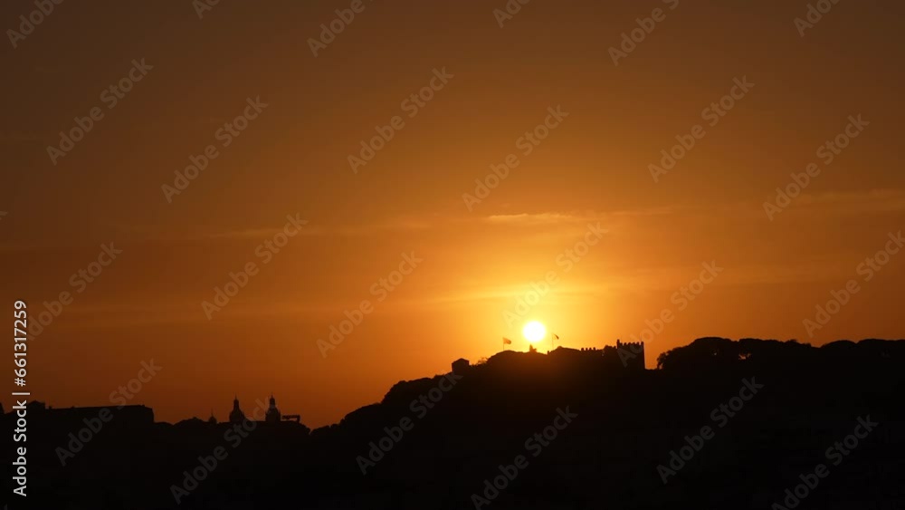 Sunrise over Lisbon. 4K time lapse video in Portugal, aerial view above over Lisbon city in the early morning with fortress, flags and landmarks. Travel to Portugal. Sunrise over Lisbon. 4K time lapse video in Portugal, aerial view above over Lisbon city in the early morning with fortress, flags and landmarks. Travel to Portugal.