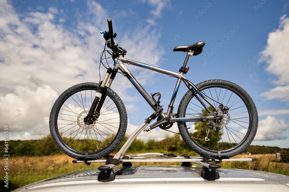 Top roof bicycle mount. Concept of transporting bikes and luggage on the top of the car.