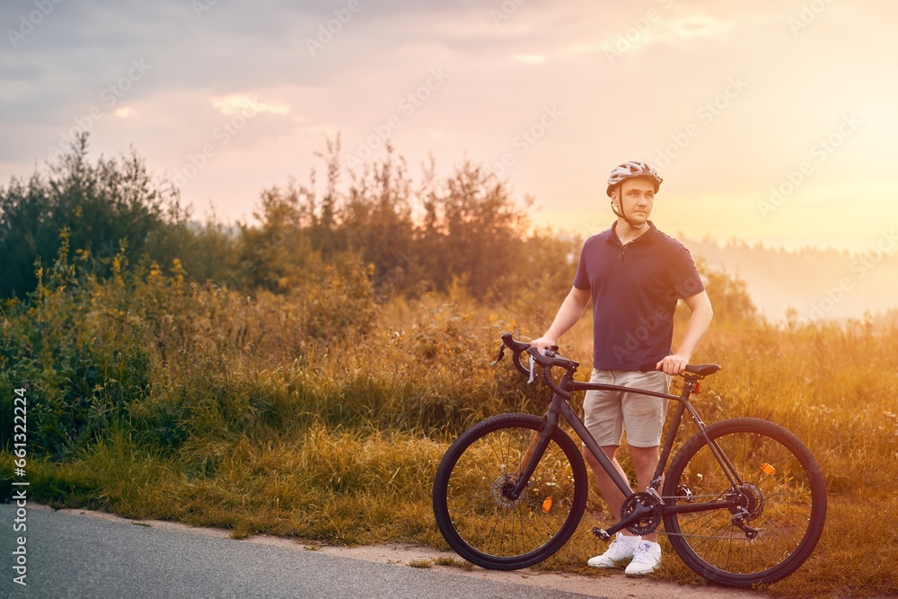 Obraz premium Man rides a bicycle. Into the Wilderness. Cycling Adventure in the Forest