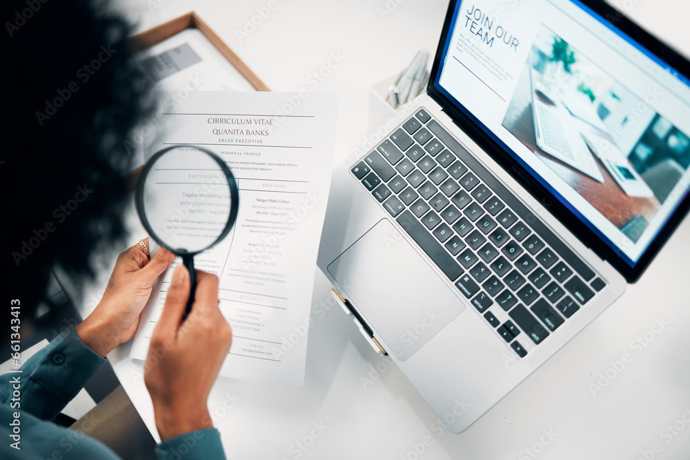 Magnifying glass, computer and woman reading cv in office for company recruitment website. Research, technology and closeup of female designer with hiring paperwork and laptop in workplace. - obrazy, fototapety, plakaty 