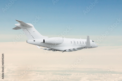 White luxury business jet fly in the air above the clouds