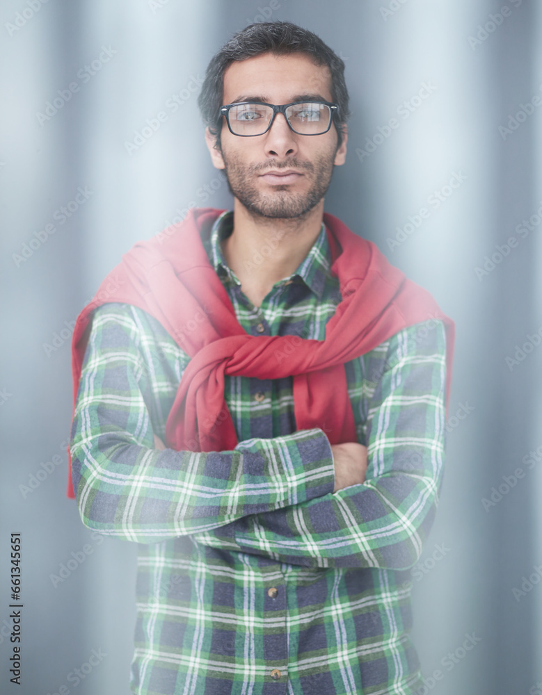 Fototapeta premium Stylish young man posing in the studio on gray background