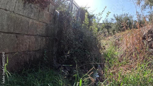 water falling down a wall of concrete blocks