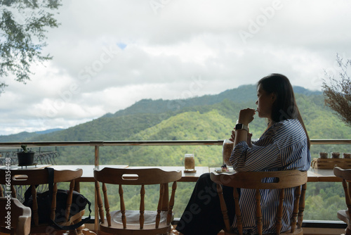 digital nomad concept asian freelancer woman relax and outdoor work at mountain view of coffeeshop © tickcharoen04
