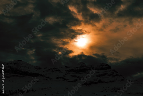 sunset in the snowy mountains. dramatic sky at sunset. sunset in the alps. sunset in winter. sunset over the mountains