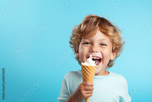 Cheerful happy kid eating ice cream in waffle cone isolated on blue background with copy space. Generative AI.