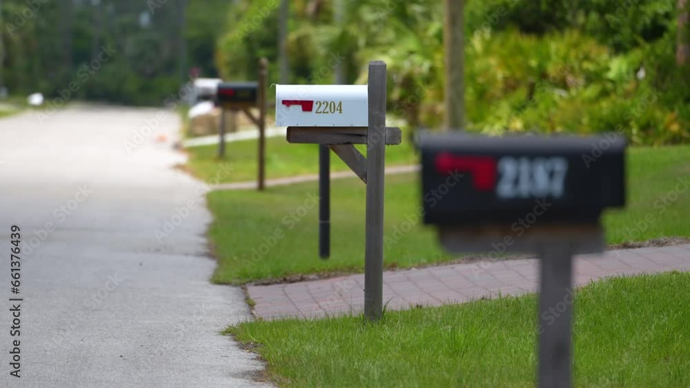 American mailbox at Florida home front yard on suburban street side American mailbox at Florida home front yard on suburban street side