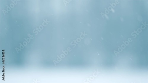 Winter abstract background with snow. Snowfall. Falling snow nature backdrop. Blurred winter backdrop with snow flakes on the wind. Outdoor Christmas scene. Slow motion. 