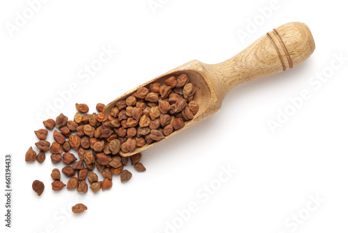 Organic Black Chickpeas (Cicer arietinum) or Kala Chana in a wooden scoop, isolated on a white background. Top view.