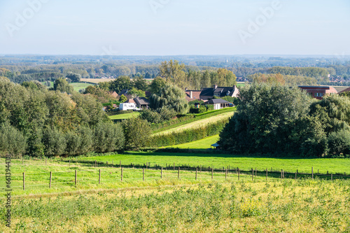 Panoramic view over green hills and agriculture fields at the Flemish countryside around Geraardsbergen, Flanders Region, Belgium photo