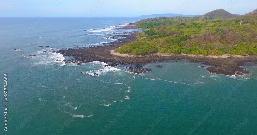 Drone shot flying away from Piedra Point on the Nicoya Peninsula in Costa Rica on a sunny summer day Drone shot flying away from Piedra Point on the Nicoya Peninsula in Costa Rica on a sunny summer day