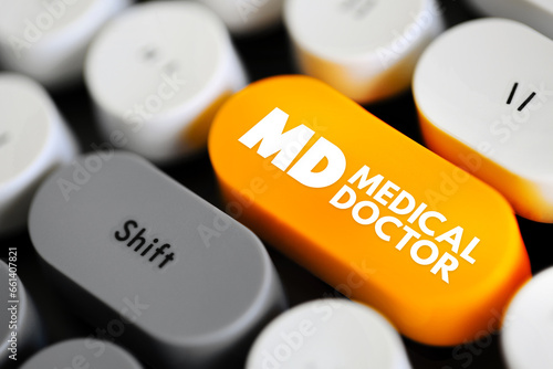 MD - Medical Doctor is a licensed physician who is a graduate of an accredited medical school, acronym text concept button on keyboard