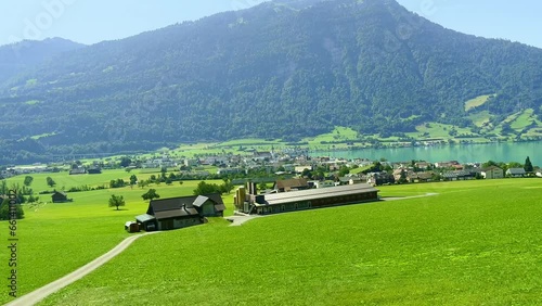 Train Point of View over Lake Zug and Mountain in a Sunny Summer Day in Arth Goldau, Schwyz, Switzerland. photo