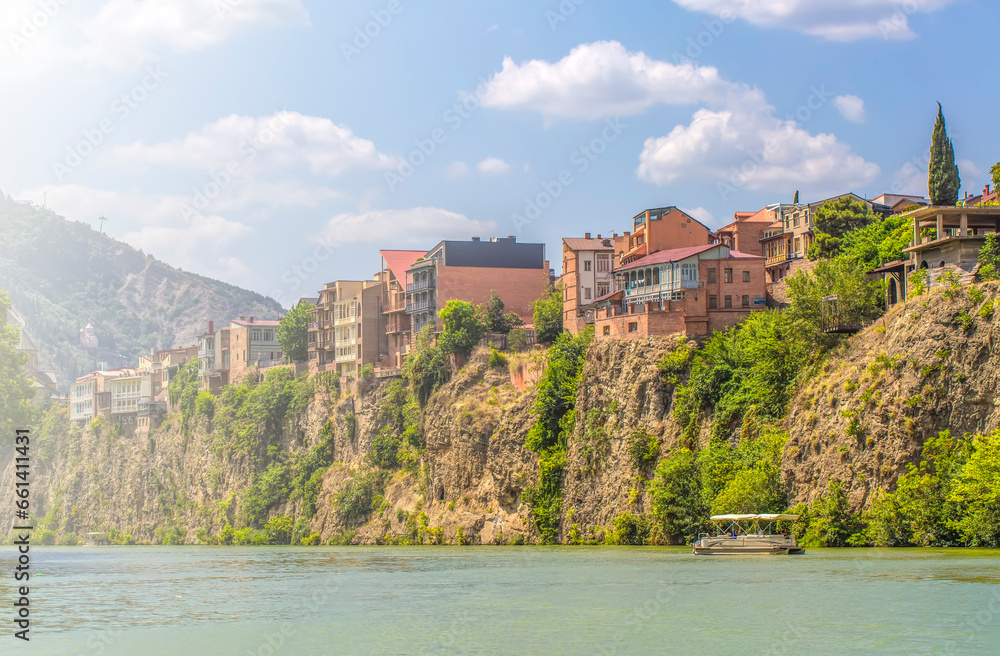 Houses on the edge of a cliff above the river Kura. Tbilisi, the historic city