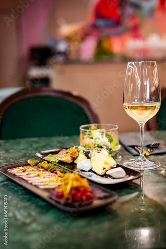 Fototapeta Naklejka Na Ścianę i Meble -  tasting set appetizer food and white wine glass
