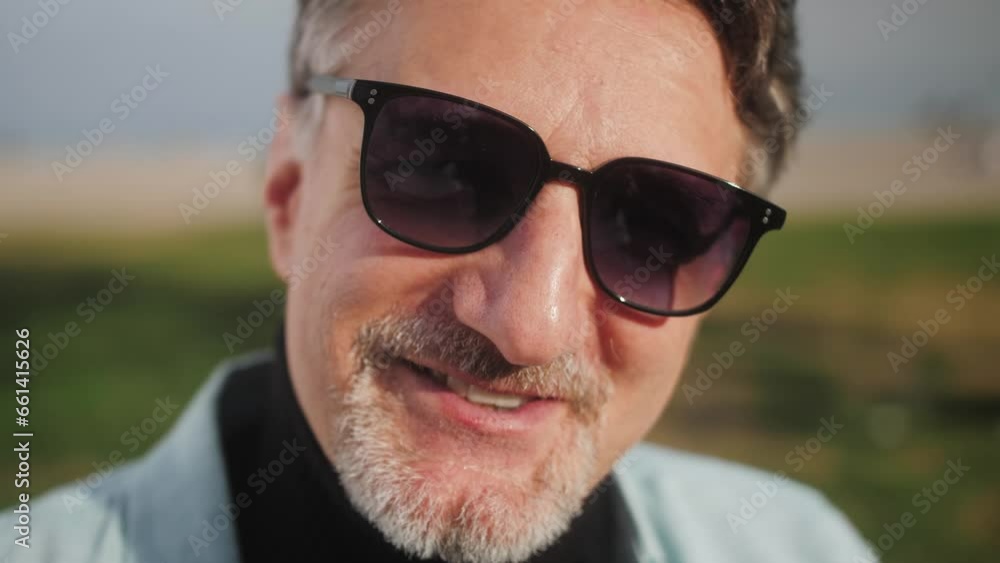 Close-up portrait of young handsome Arab man smiling looking at camera. People, city lifestyle. Close-up portrait of young handsome Arab man smiling looking at camera. People, city lifestyle.
