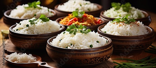Rice dishes are varied with different flavors textures and preparation methods found in cuisines worldwide With copyspace for text