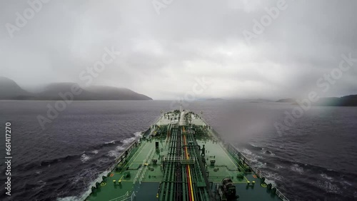 Timelapse oil tanker transit crossing Strait Magellan Punta arenas cloudy rain photo