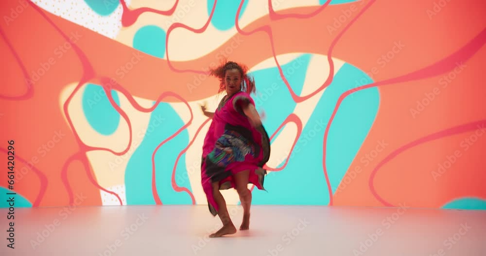 Portrait of a Talented Black Female Artist Showcasing Dance Movements in Studio with Abstract Art Background. African Woman Expressing Emotions with Her Innovative Modern Dance Routine Portrait of a Talented Black Female Artist Showcasing Dance Movements in Studio with Abstract Art Background. African Woman Expressing Emotions with Her Innovative Modern Dance Routine