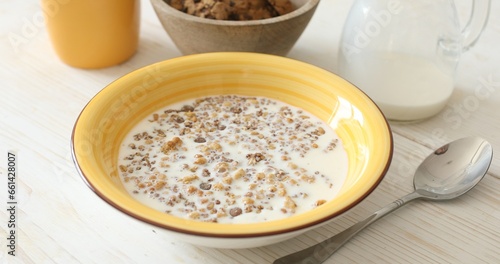 Granola or muesli with milk in a bowl. Healthy food. Preparing breakfast. Close-up.