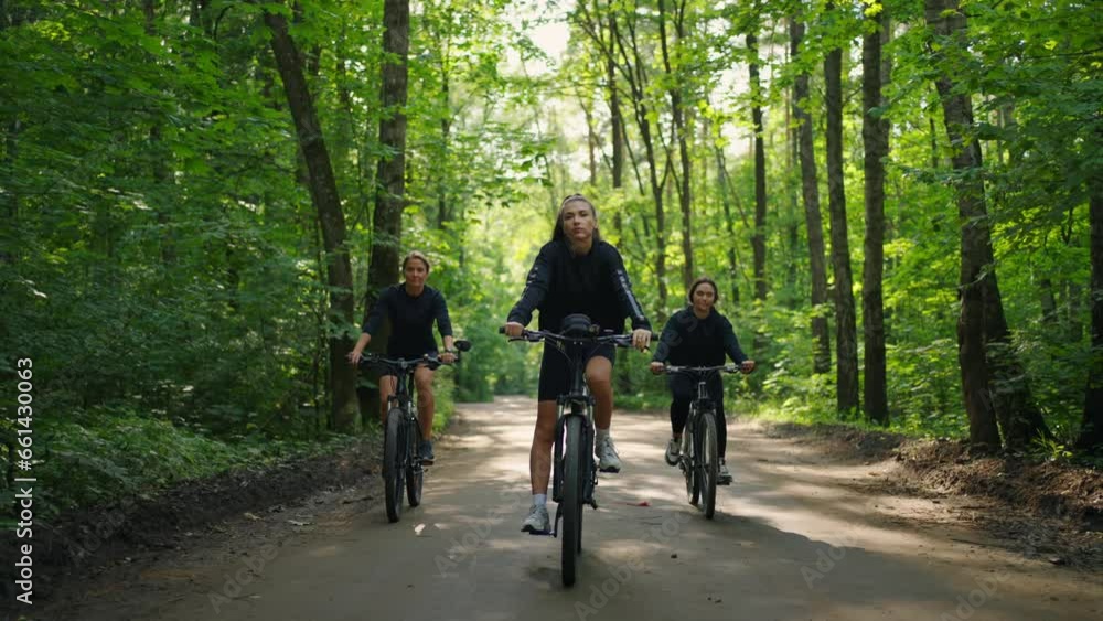 Group Of Female Cyclists In Beautiful Forest, Frontal View, Sport And Recreation In Nature Group Of Female Cyclists In Beautiful Forest, Frontal View, Sport And Recreation In Nature