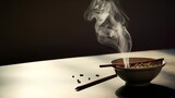Incense sticks are burning in incense pot
