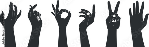 Set of raised human hands silhouettes with different gestures. Isolated vector illustration of human hands