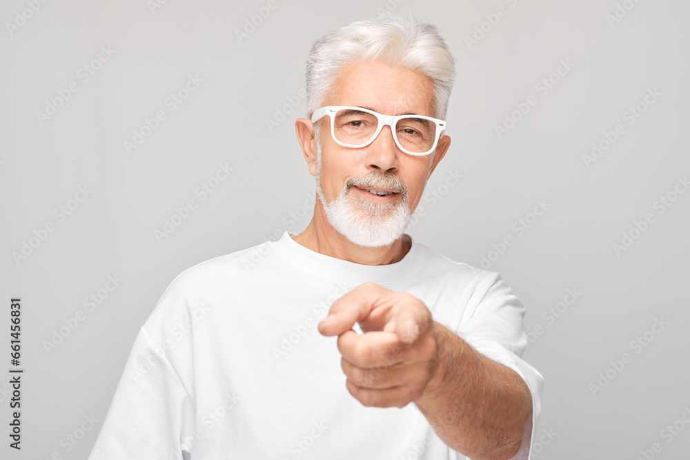 Portrait of confident adult man in white clothes chooses you finger points at camera isolated on white studio background. Welcome gesture, join our team concept Portrait of confident adult man in white clothes chooses you finger points at camera isolated on white studio background. Welcome gesture, join our team concept