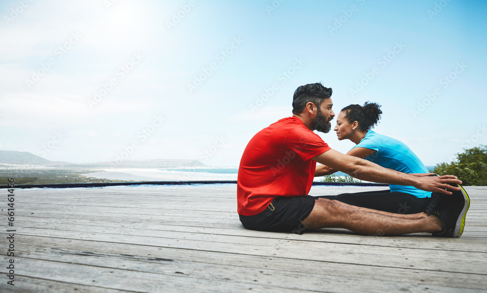 Couple, stretching and legs in exercise at beach to start fitness, training or outdoor with blue sky mockup. Workout, preparation and people together for sports, performance and feet on a deck