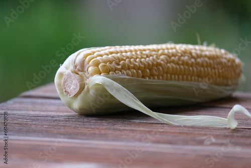 close up of corn on a wooden table
