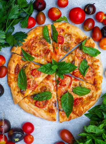 pizza margherita with tomatoes and basil