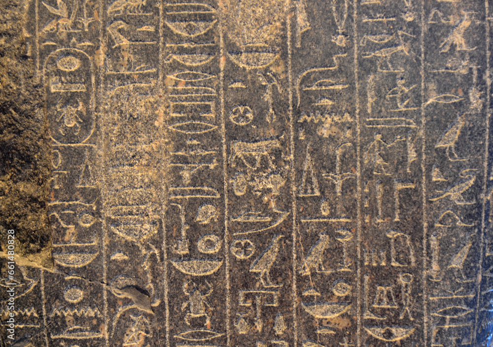 Ancient Egyptian folk letters on black stone in pyramid