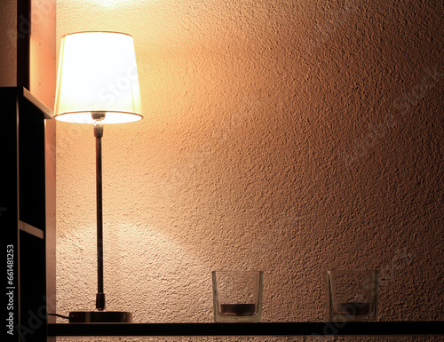 Lamp And Candles On A Book Shelf